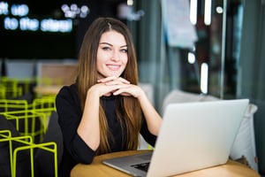 woman watching video on laptop